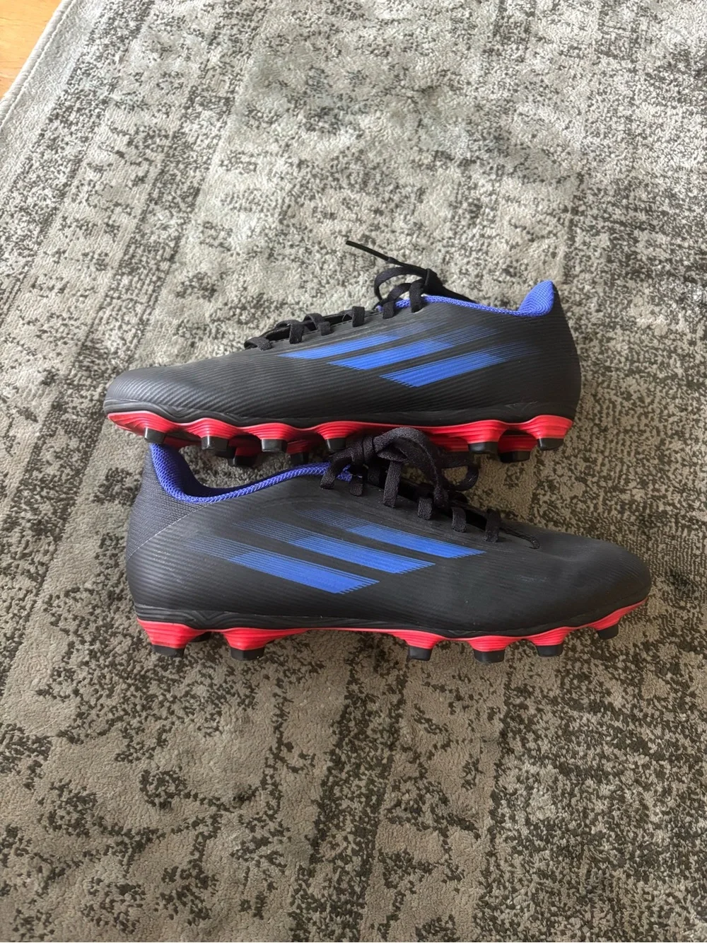 adidas Kids Black Soccer Cleats with Blue Logos and Pink Soles